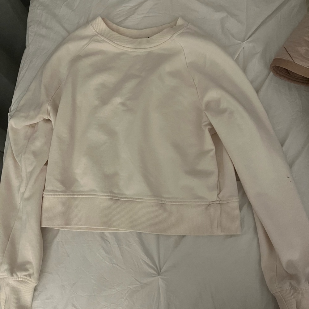 A cropped white sweatshirt.
